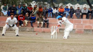 A batsman playing a shot during a match in the ongoing Police Martyrs Memorial T-20 Tournament at Sports Stadium, Kathua. 