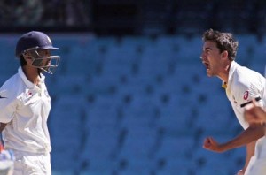 Australia's Mitchell Starc (R) reacts after he dismissed India's Murali Vijay (L) for a duck during the second day's play in the fourth test at the Sydney Cricket Ground (SCG).