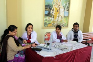 Doctors examining patients during 7th Medical Camp at Panjwakhtar Temple on Thursday.