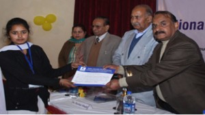 Certificate being presented by dignitories to a winner during Youth Conclave on Saturday. 