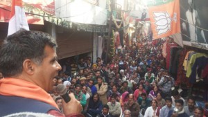 MLA Ravinder Raina addressing the gathering at Nowshera in Rajouri. 