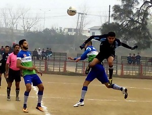 Players in action during football match at GGM Science College football ground on Monday. -Excelsior/Rakesh