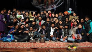 GNDU teams with Overall Championship Trophy posing for group photograph during valedictory function of North Zone Inter-University Youth Festival at JU on Monday.