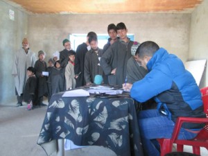 A doctor examining patients during medical camp on Friday.