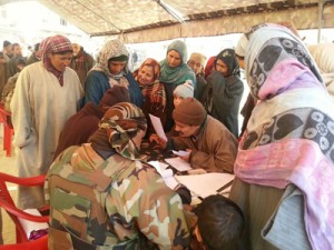 Doctors examining people during medical-cum-veterinary camp at Delina in Baramulla on Monday.