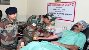 A soldier donating blood during camp at Military Hospital in Jammu on Tuesday.