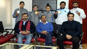 Medal winners posing for group photograph with officials of Wushu Association of J&K.