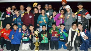 Medal winners posing for group photograph.