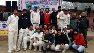 Gateway Cricket Club Srinagar posing for a group photograph after clinching victory over Manwal Club in 5th Police Martyrs Memorial NZ T20 Cricket Tournament at Kathua on Tuesday.
