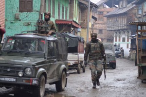 Army soldiers in action during encounter near Sopore on      Wednesday. (Another pic on page 10)-Excelsior/Aabid Nabi