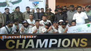 Winners of BPL posing for group Photograph at Bandipora in Kashmir on Thursday. -Excelsior/Aabid Nabi