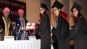 Vice Chancellor, JU, Prof RD Sharma alongwith Principal-Dean, GMC Jammu, Dr. Ghanshyam Dev awarding degrees to first three toppers in MBBS for the year 2013-14. -Excelsior/Rakesh