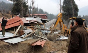 Illegal structures being demolished in Pahalgam. —Excelsior/Younis Khaliq