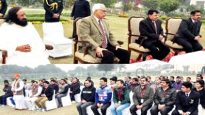 Governor N N Vohra and Guru Ravishankarji interacting with the employees of SMVDSB.