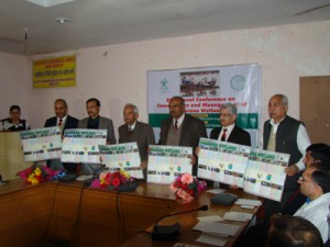 Poster on Conservation of Gharana Wetland being released during workshop in Jammu on Monday.