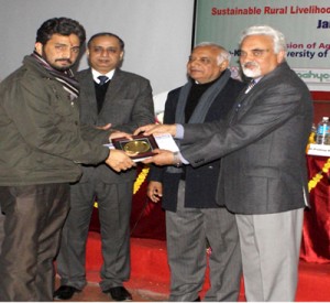 Dr Vivek M Arya receiving award from Vice Chancellor Deputy Director General (DDG)  Dr P L Gautam (Ex VC-Pant Nagar)