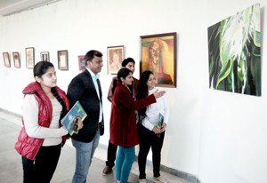 Visitors evincing keen interest at the exhibition of visual arts.            -Excelsior/Rakesh