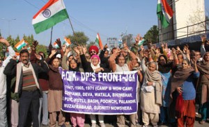 PoJK refugees staging protest demonstration near Press Club, Jammu on Thursday.  -Excelsior/ Rakesh