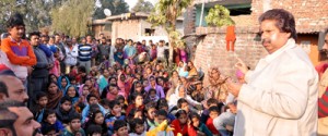 Former Minister, Raman Bhalla addressing a gathering at Chatha on Monday.