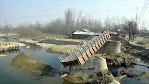 Damaged bridge on Romushi rivulet at Gudoora in Pulwama crying for renovation.