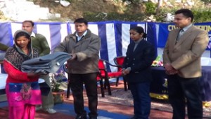 CRPF officials distributing blankets under Civic Action Programme on Friday.