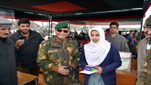 GOC Chinar Corps Lt Gen Subrata Saha distributing prize among winners during Milan programme at Shopian.