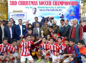  Winners of 5th Christmas Soccer Championship posing along with the dignitaries at GGM Science College football ground in Jammu on Monday.