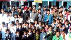 Participants of 2nd J&K State Sambo Championship posing for a group photograph along with the chief guest Dr Nirmal Singh in Jammu on Wednesday.