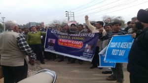 LIC agents raising slogans during protest at Jammu on Saturday.