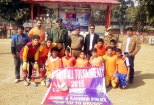 Winners posing along with dignitaries and officials during a match of Football Tournament 2015 at GGM Science College football ground on Saturday.