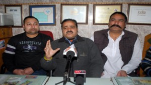 President, TWA General Bus Stand Jammu, Romesh Kumar Tak along with others, addressing a press conference at Jammu on Friday.