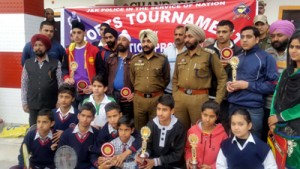 Winners of various events posing along with the chief guest and other dignitaries during the concluding ceremony of badminton Championship.