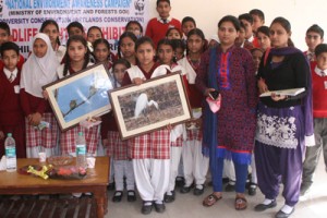 Winners displaying beautiful paintings during closing ceremony of painting competition on Saturday.