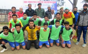 Winners of football semifinal match posing for a group photograph along with the dignitaries at GGM Science College ground in Jammu on Saturday.