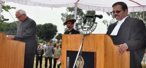 Governor N N Vohra administering oath to the Chief Justice of J&K High Court in Jammu on Monday.