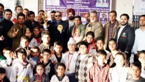 Winners of Taekwondo Championship posing along with the chief guest, Navin Agarwal, DG Sports and other dignitaries in Jammu on Friday.