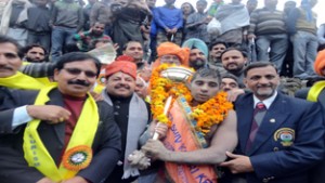 Winner wrestler Amit of Delhi posing along with the dignitaries at Government High School Ransoo in Reasi.