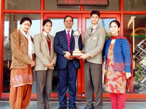 Winners of Debate Competition posing for a group photograph along with Principal at Jodhamal Public School in Jammu.