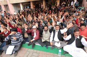 PHE workers raising slogans during protest at Jammu on Monday. -Excelsior/Rakesh