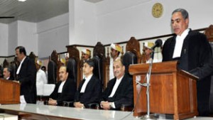 Chief Justice N N Paul Vasanthakumar administering oath to Justice Bawa Singh Walia as Additional Judge of J&K HC of Thursday.