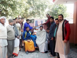 BJP leader Chander Mohan garlanding portrait of Maj Som Nath on Sunday.