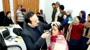 Employees of the Shrine Board undergoing eye check up at Katra on Tuesday.