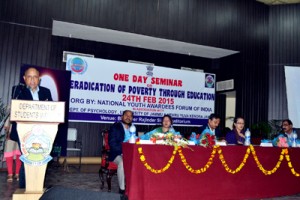 A speaker expressing his views during seminar on ‘Eradication of poverty through education’ on Tuesday.