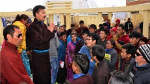 CEC Rigzin Spalbar interacting with students at Leh on Saturday.