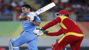 India's MS Dhoni hits a six watched by Zimbabwe's Brendan Taylor during their Cricket World Cup match at Eden Park in Auckland, on Saturday. (UNI)