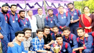 Winners of friendly cricket match posing for a group photograph along with dignitaries at Tawi Technical Campus in Jammu.