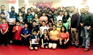 Winners of Table Tennis Tournament posing for group photograph with SSP Jammu Uttam Chand and SP Headquarters Randheer Singh at Jammu on Monday.   -Excelsior/Rakesh