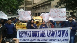 Resident doctors during a protest in the premises of GMCH, Jammu on Monday.