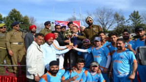 Winners posing along with the chief guest and other dignitaries during valedictory function of T20 Cricket Tournament in Poonch.