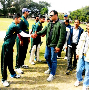 SP Ranjeet Singh interacting with players during a match of JKPL T20 Cricket Tournament at GGM Science College ground in Jammu on Thursday.
